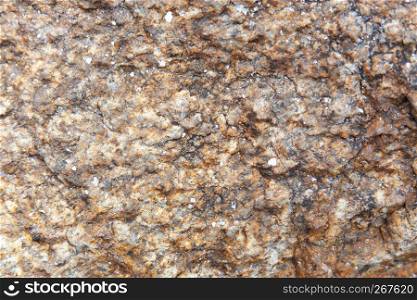 Abstract nature grunge texture background of dark brown granite rock with detail, rough and rustic.