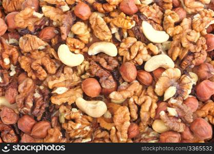 Abstract nuts background. Yellow-brown palette. Close-up. Studio photography.