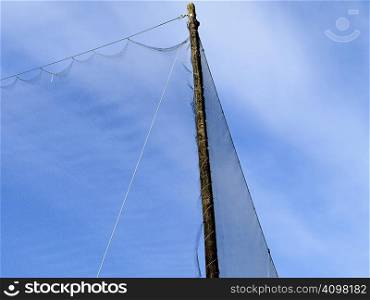 Abstract of a driving range net beside a major roadway.