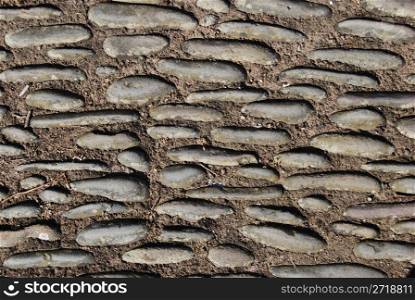 abstract of a pavement made out of concrete and stones