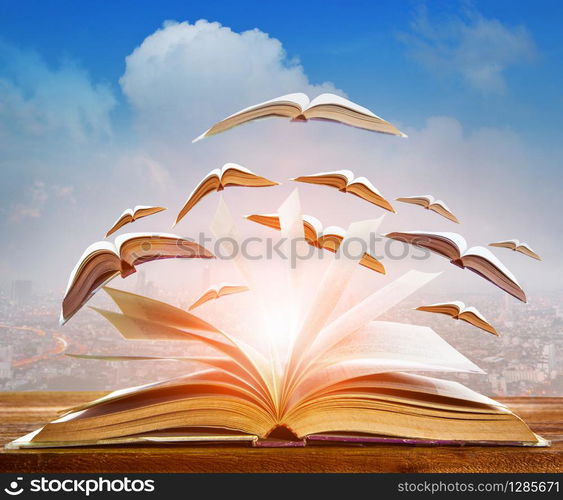 abstract of open book flying as knowledge wisdom going to future