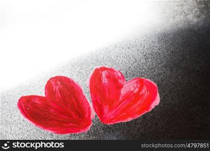 Abstract painted hearts. Two abstract red painted hearts on metal background