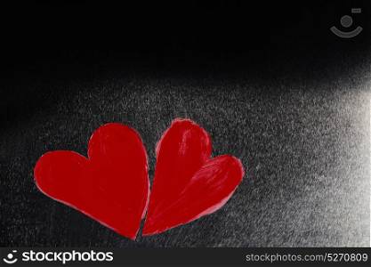 Abstract painted hearts. Two abstract red painted hearts on metal background