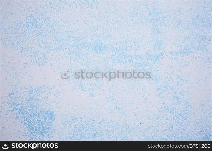 abstract pattern of blue paint on wall