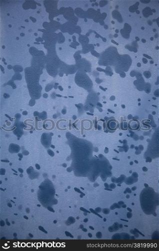 abstract pattern of raindrops on blue material
