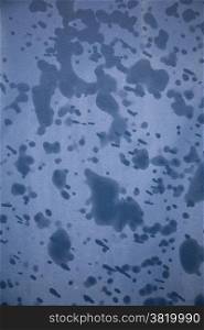 abstract pattern of raindrops on blue material