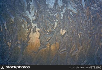 Abstract pattern on a window glass made by frost
