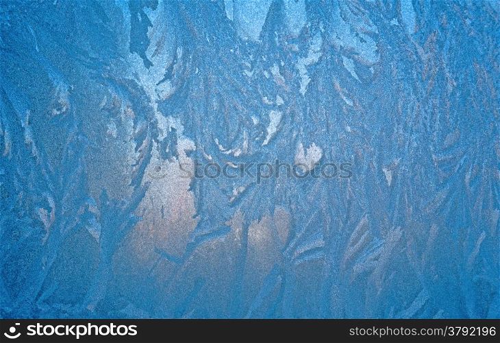 Abstract pattern on a window glass made by frost