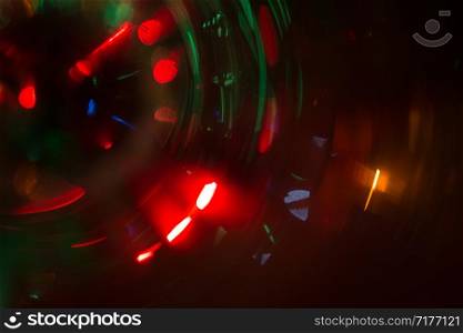 Abstract photo of blurry light sources of different colors twisted into a circle.. Abstract photo of blurry light sources of different colors twisted into a circle
