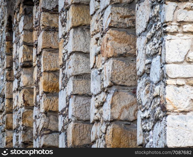 Abstract photo of the back very thick stone wall of a hotel in the Goslar old town