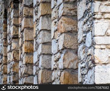 Abstract photo of the back very thick stone wall of a hotel in the Goslar old town