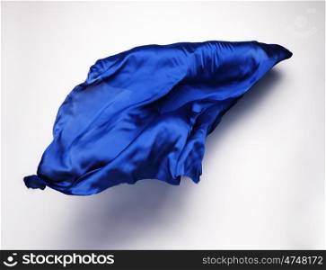 abstract piece of blue fabric flying, high-speed studio shot