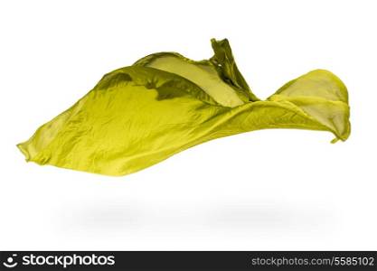abstract pieces of olive fabric flying, high-speed studio shot