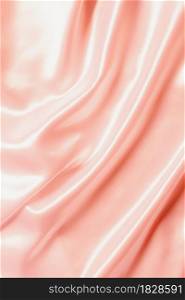 Abstract Rose gold Satin Silky Cloth for background, Fabric Textile Drape with Crease Wavy Folds.with soft waves,waving in the wind.
