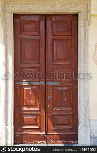 abstract santo macario rusty brass brown knocker in a door curch closed wood lombardy italy varese