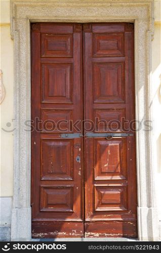 abstract santo macario rusty brass brown knocker in a door curch closed wood lombardy italy varese
