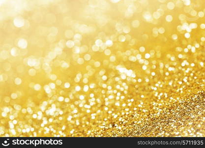 Abstract shining glitters gold holiday bokeh background