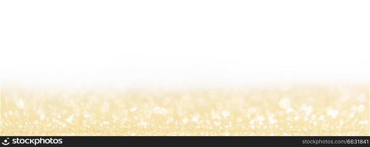 Abstract shining glitters golden on white holiday bokeh background with copy space for text. Abstract golden background