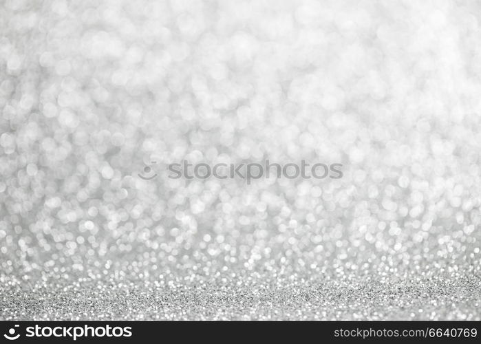 Abstract shining silver glitters bokeh background with copy space for text. Abstract silver background