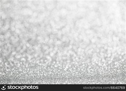 Abstract shining silver glitters bokeh background with copy space for text. Abstract silver background