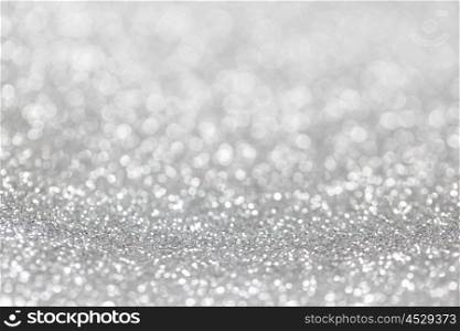 Abstract silver glitter background. Abstract silver glitter light bokeh holiday party background
