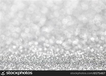 Abstract silver glitter light bokeh holiday party background. Abstract silver glitter background