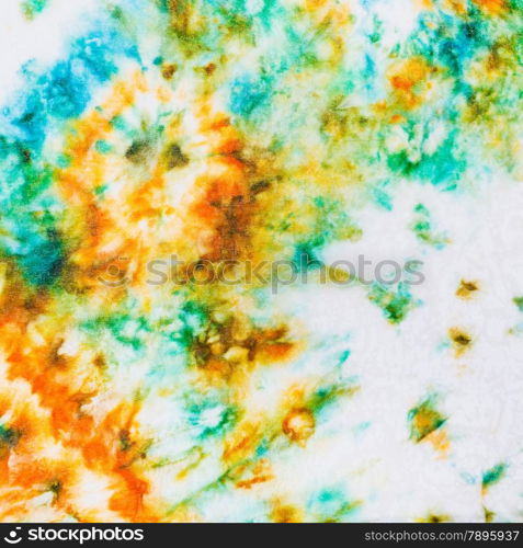 abstract stains of batik painted on white silk close up