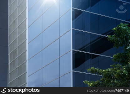 Abstract steel and glass facade detail background of high rise commercial building .Business or industrial successful concept background .