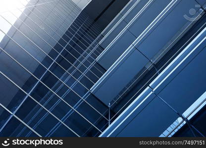 Abstract steel and glass facade detail background of high rise commercial building .Business or industrial successful concept background .
