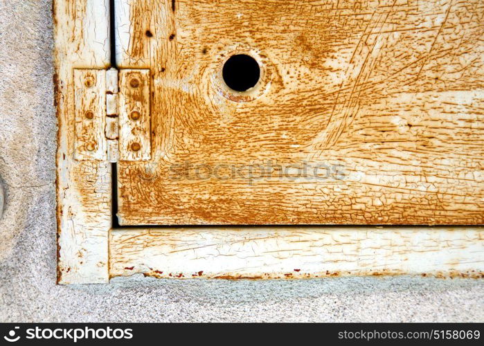 abstract steel padock in a closed rusty metal pattern door varese italy sumirago