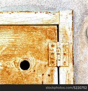 abstract steel padock in a closed rusty metal pattern door varese italy sumirago