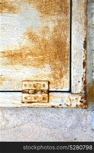 abstract steel padock zip in a closed rusty metal pattern door varese italy sumirago