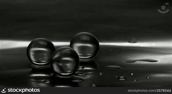 Abstract still-life. Panorama with water droplets over steel surface