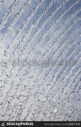 Abstract streams of water from fountain.