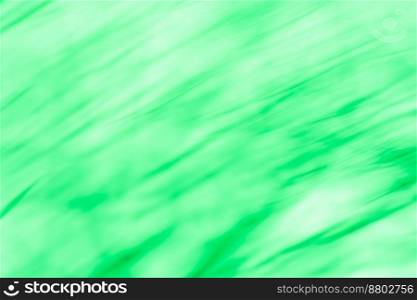Abstract swirl blurry effect green background. Radial motion abstract green background.. Lights in circular green motion. Abstract green spinning radial light trail.