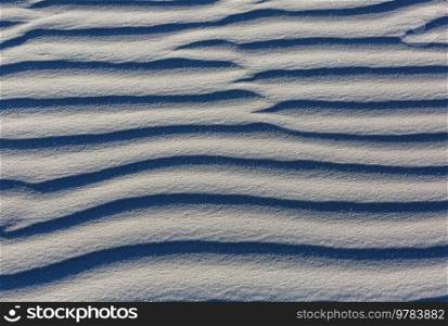 Abstract texture- circle drawn with dry grass on the sand