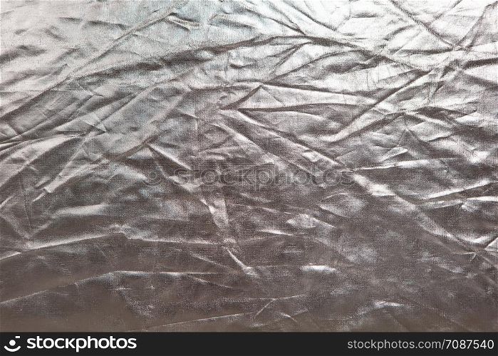 Abstract texture. Crumpled silver metallic shiny fabric background. Copy space for text. Horizontal and vertical. Celebration, holidays concept, harvesting for mock up.