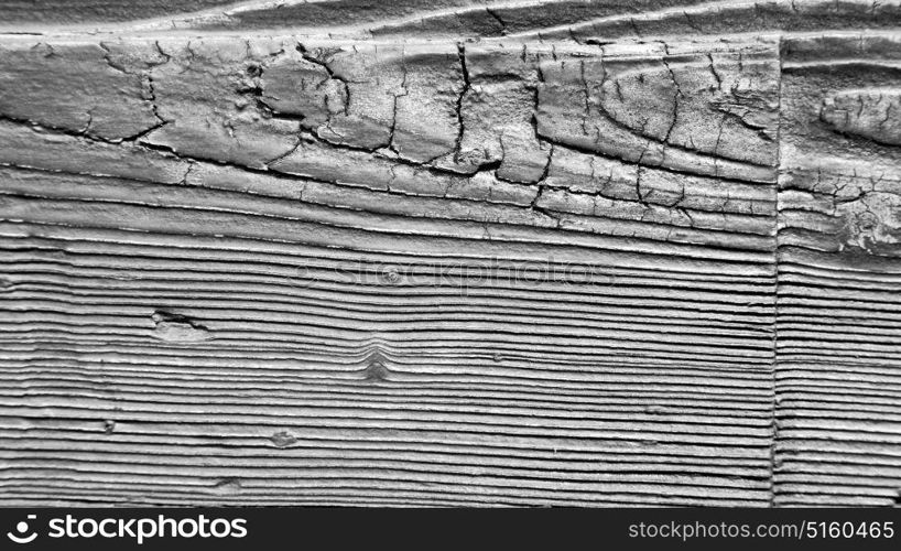 abstract texture of a brown antique wooden old door in italy europe