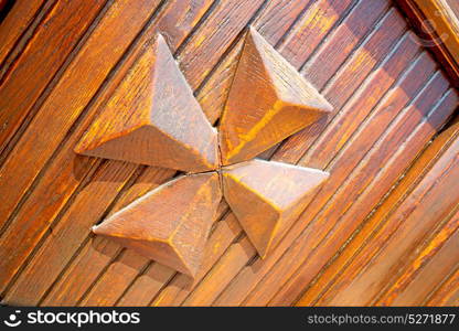 abstract texture of a brown antique wooden old door in italy europe