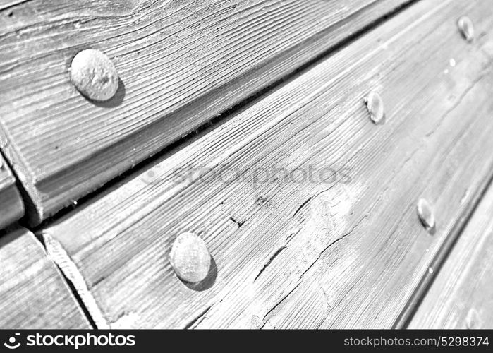 abstract texture of a brown antique wooden old door in italy europe