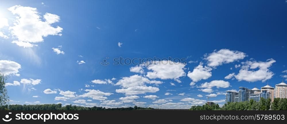 Abstract urban panorama with residential buildings and blue skies