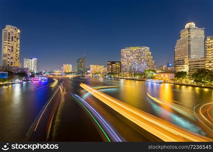 abstract urban twilight bokeh and reflect ship transport light from water in city background