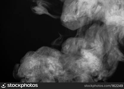 Abstract white smoke texture on a dark background.