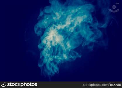 Abstract white smoke texture on a dark background, post processing.