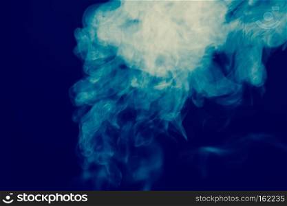 Abstract white smoke texture on a dark background, post processing.