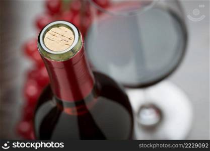 Abstract Wine Bottle, Cork, Glass and Red Grapes.