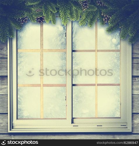 Abstract winter backgrounds with vintage window and pine tree