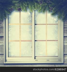 Abstract winter backgrounds with vintage window and pine tree