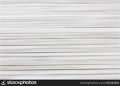 Abstract wood background. Background of grey wooden planks on dock created by horizontal in-camera motion blur