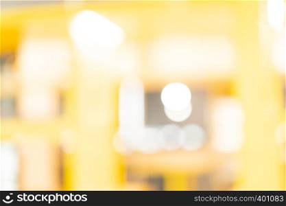 abstract yellow blur background at shopping mall for design , Bokeh on yellow background